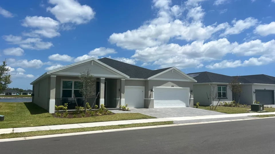 New single-story home at Hampton Park under a blue Florida sky